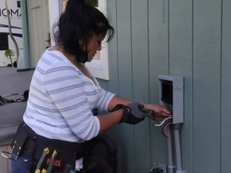 Licensed electrician wiring an exterior subpanel in Skowhegan